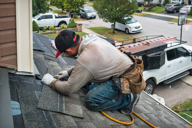 Professional Roofing technician working in Rossville, MD